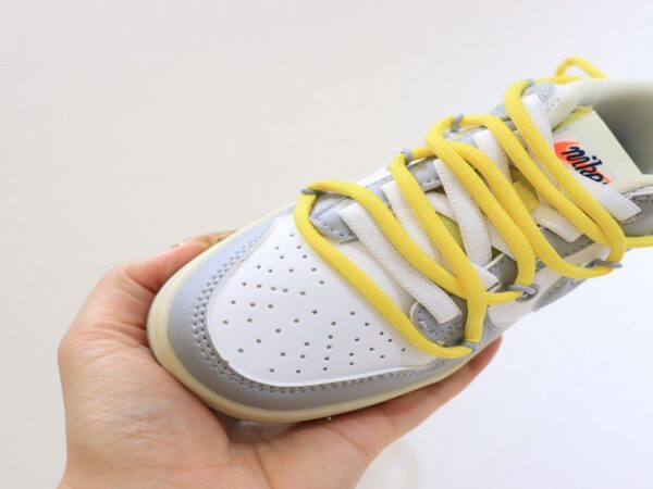 Giày Nike SB Dunk Low trẻ em màu ghi dây vàng